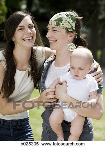 baby with her mother and aunt View Large Photo Image Stock Photography - baby with her mother and aunt. Fotosearch
