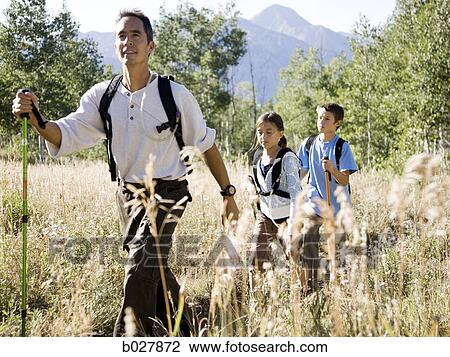 backpackers hiking through the wilderness View Large Photo Image Stock Image - backpackers hiking through the wilderness. Fotosearch