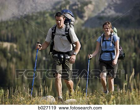 backpackers hiking through the wilderness View Large Photo Image Stock Photo - backpackers hiking through the wilderness. Fotosearch