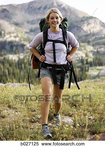Stock Photography - backpackers hiking through the wilderness. Fotosearch