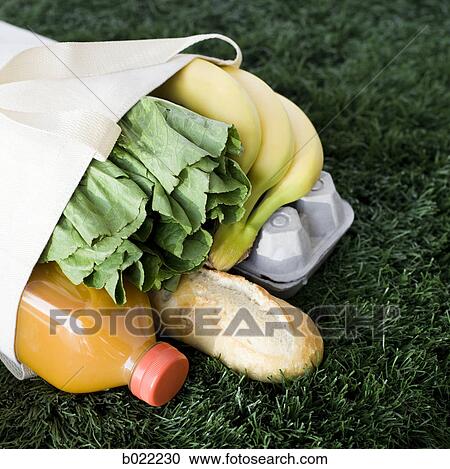 bag full of groceries on the grass View Large Photo Image Stock Image - bag full of groceries on the grass. Fotosearch