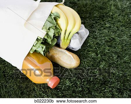 bag full of groceries on the grass View Large Photo Image Stock Image - bag full of groceries on the grass. Fotosearch