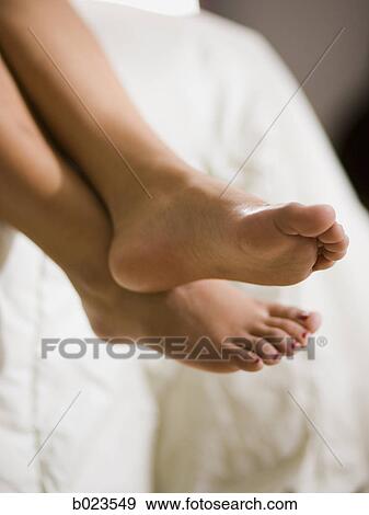 bare feet hanging off the bed View Large Photo Image Stock Photo - bare feet hanging off the bed. Fotosearch