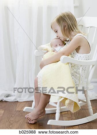 big sister holding her newborn brother View Large Photo Image Stock Photo - big sister holding her newborn brother. Fotosearch