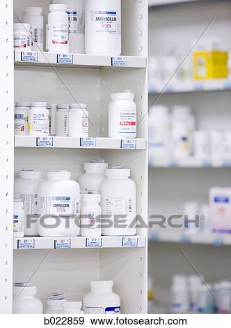 Stock Photo - bottles on the shelves at a pharmacy. Fotosearch