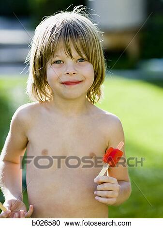 boy eating a popsicle View Large Photo Image Stock Image - boy eating a popsicle. Fotosearch