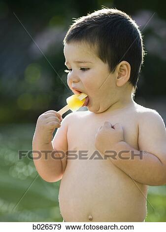 boy eating a popsicle View Large Photo Image Stock Photo - boy eating a popsicle. Fotosearch