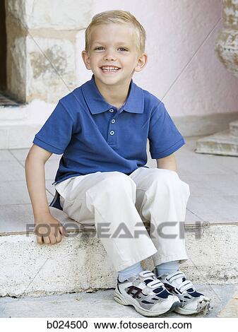 boy in a blue shirt View Large Photo Image Stock Image - boy in a blue shirt. Fotosearch
