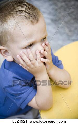 Stock Image - boy in a blue shirt. Fotosearch