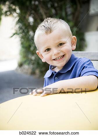 boy in a blue shirt View Large Photo Image Stock Image - boy in a blue shirt. Fotosearch