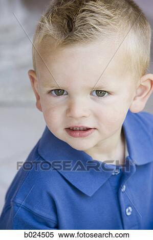 Stock Photography - boy in a blue shirt. Fotosearch