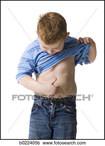 boy looking at his belly button View Large Photo Image Stock Image - boy looking at his belly button. Fotosearch