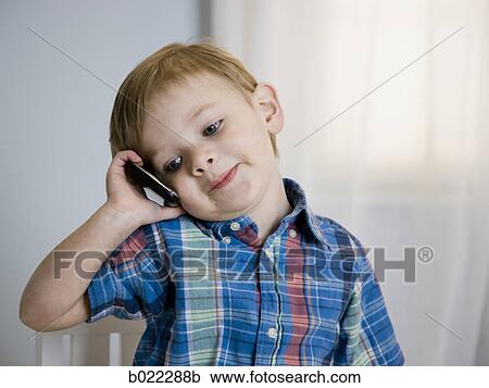 boy on a cell phone View Large Photo Image Stock Image - boy on a cell phone. Fotosearch