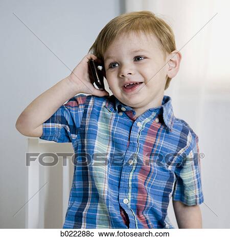 Stock Image - boy on a cell phone. Fotosearch