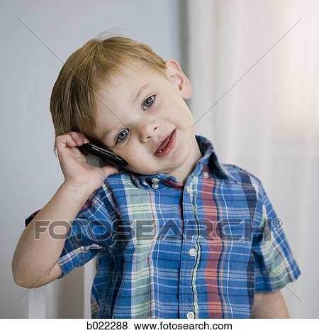 boy on a cell phone View Large Photo Image Stock Photo - boy on a cell phone. Fotosearch