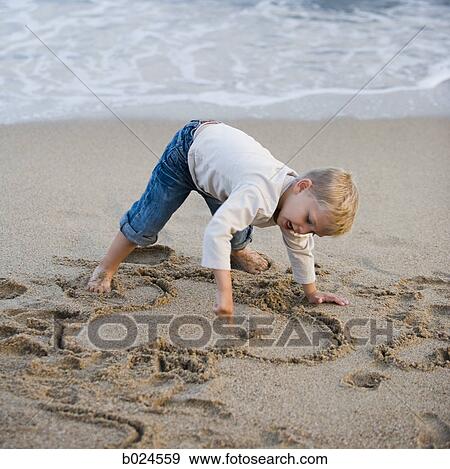 boy playing in the sand View Large Photo Image Stock Photo - boy playing in the sand. Fotosearch
