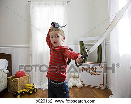 boy pretending to be a pirate in his bedroom View Large Photo Image Stock Image - boy pretending to be a pirate in his bedroom. Fotosearch