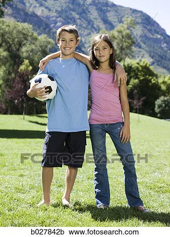brother and sister with a football View Large Photo Image Stock Image - brother and sister with a football. Fotosearch