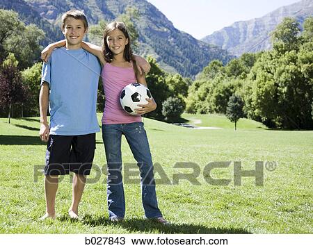 brother and sister with a soccer ball View Large Photo Image Stock Image - brother and sister with a soccer ball. Fotosearch