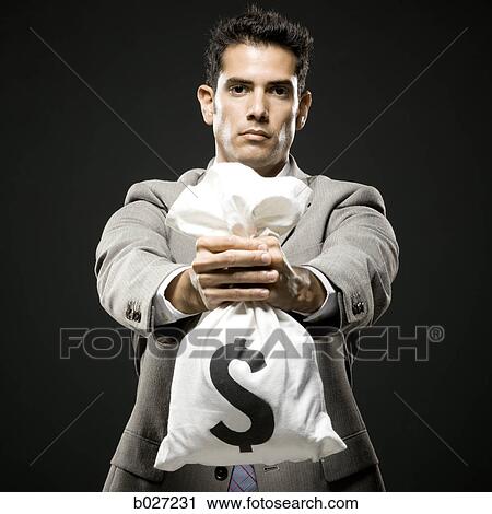 businessman holding a bag of money View Large Photo Image Stock Image - businessman holding a bag of money. Fotosearch