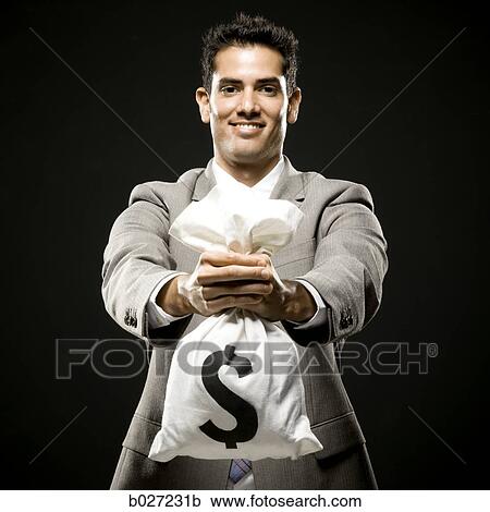 businessman holding a bag of money View Large Photo Image Stock Image - businessman holding a bag of money. Fotosearch
