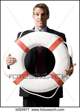 businessman holding a life preserver View Large Photo Image Stock Photo - businessman holding a life preserver. Fotosearch