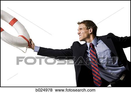 businessman holding a life preserver View Large Photo Image Stock Photo - businessman holding a life preserver. Fotosearch
