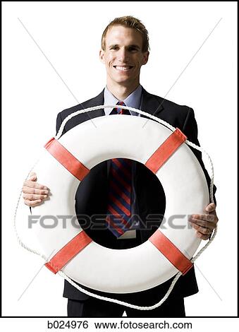 businessman holding a life preserver View Large Photo Image Stock Photograph - businessman holding a life preserver. Fotosearch