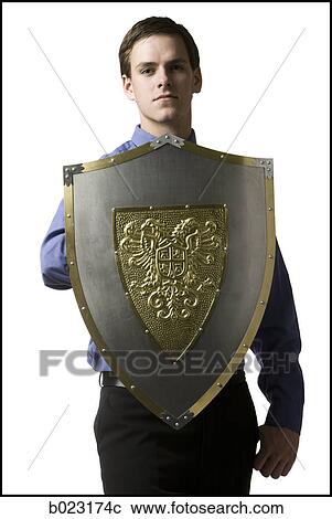 businessman holding a shield View Large Photo Image Stock Image - businessman holding a shield. Fotosearch