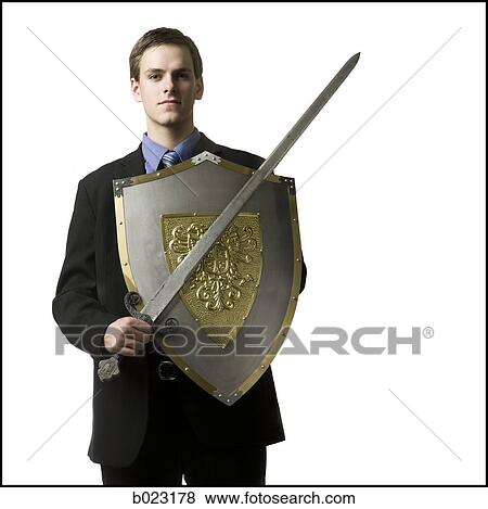 businessman holding a sword and shield View Large Photo Image Stock Photo - businessman holding a sword and shield. Fotosearch