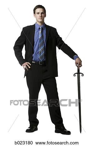 businessman holding a sword View Large Photo Image Stock Image - businessman holding a sword. Fotosearch
