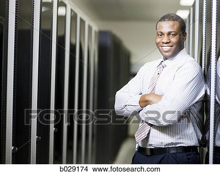 businessman in a server room View Large Photo Image Picture - businessman in a server room. Fotosearch