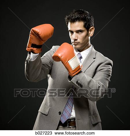 businessman wearing boxing gloves View Large Photo Image Stock Image - businessman wearing boxing gloves. Fotosearch