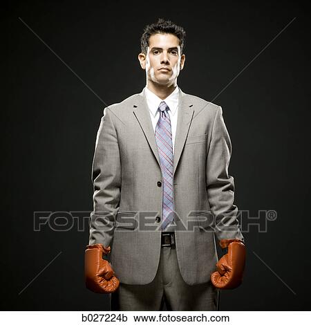 businessman wearing boxing gloves View Large Photo Image Stock Image - businessman wearing boxing gloves. Fotosearch