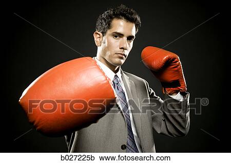 businessman wearing boxing gloves View Large Photo Image Stock Image - businessman wearing boxing gloves. Fotosearch