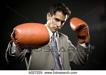 businessman wearing boxing gloves View Large Photo Image Stock Photography - businessman wearing boxing gloves. Fotosearch
