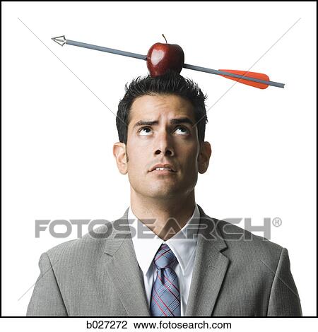 businessman with an apple on his head that has been shot with an arrow View Large Photo Image Stock Image - businessman with an apple on his head that has been shot with an arrow. Fotosearch