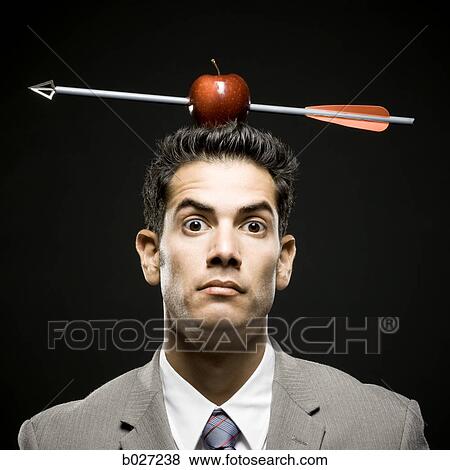 businessman with an apple on his head that has been shot with an arrow View Large Photo Image Stock Photo - businessman with an apple on his head that has been shot with an arrow. Fotosearch