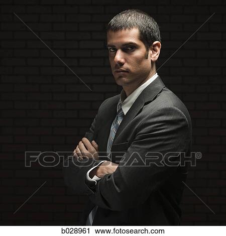 Stock Image - businessman with his arms folded. Fotosearch