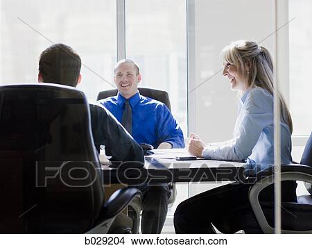 businesspeople in a meeting View Large Photo Image Picture - businesspeople in a meeting. Fotosearch
