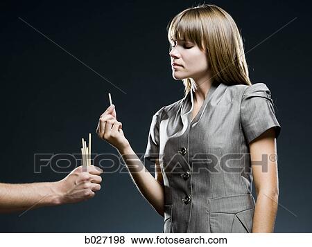 businesswoman drawing straws View Large Photo Image Stock Photo - businesswoman drawing straws. Fotosearch