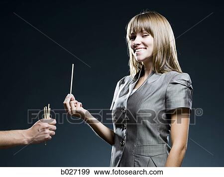 businesswoman drawing straws View Large Photo Image Stock Photo - businesswoman drawing straws. Fotosearch
