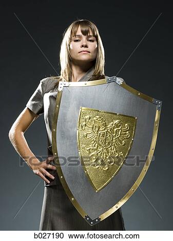 businesswoman holding a shield View Large Photo Image Stock Image - businesswoman holding a shield. Fotosearch