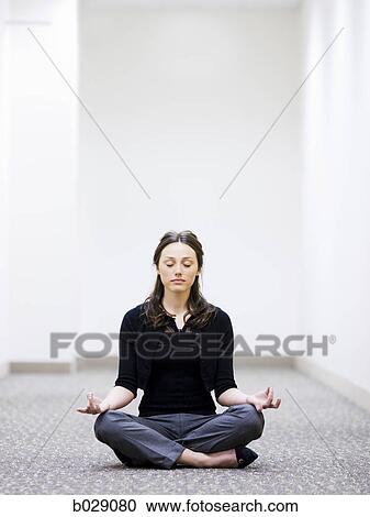 businesswoman sitting on the floor meditating View Large Photo Image Stock Image - businesswoman sitting on the floor meditating. Fotosearch