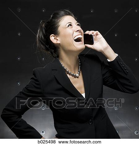 businesswoman using a cell phone View Large Photo Image Stock Photo - businesswoman using a cell phone. Fotosearch