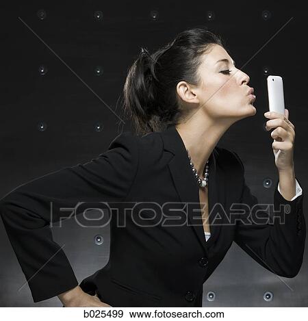businesswoman using a cell phone View Large Photo Image Stock Photo - businesswoman using a cell phone. Fotosearch