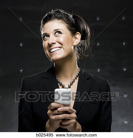 businesswoman using a cell phone View Large Photo Image Stock Photography - businesswoman using a cell phone. Fotosearch