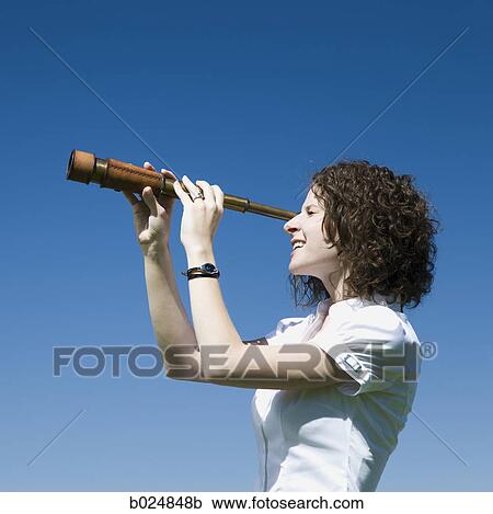 businesswoman using a spyglass telescope View Large Photo Image Stock Image - businesswoman using a spyglass telescope. Fotosearch