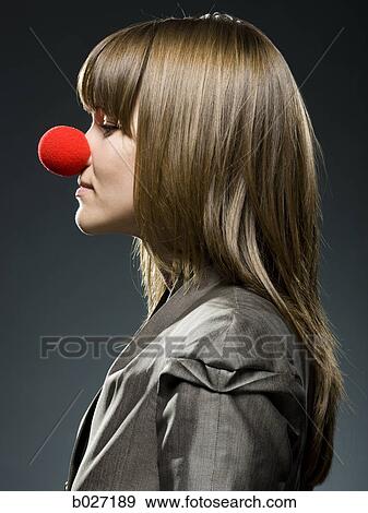 businesswoman wearing a red clown nose View Large Photo Image Stock Photo - businesswoman wearing a red clown nose. Fotosearch