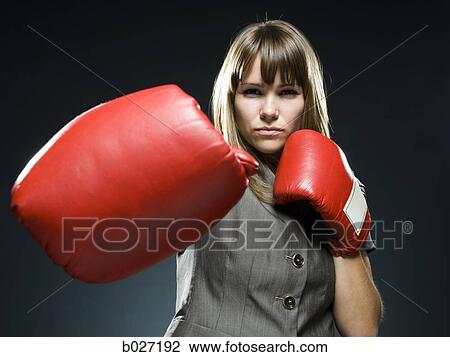 businesswoman wearing boxing gloves View Large Photo Image Stock Image - businesswoman wearing boxing gloves. Fotosearch